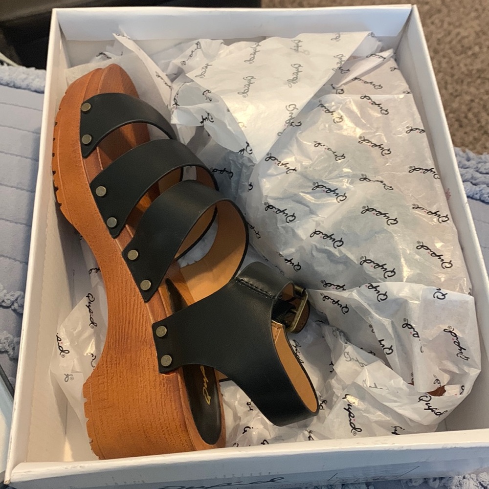 Women’s black sandals.  New!  Buckle on the sides.
